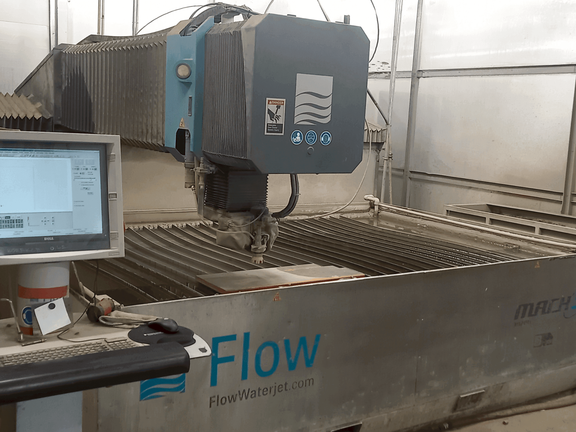 Front view of Flow Mach 3-3020b machine