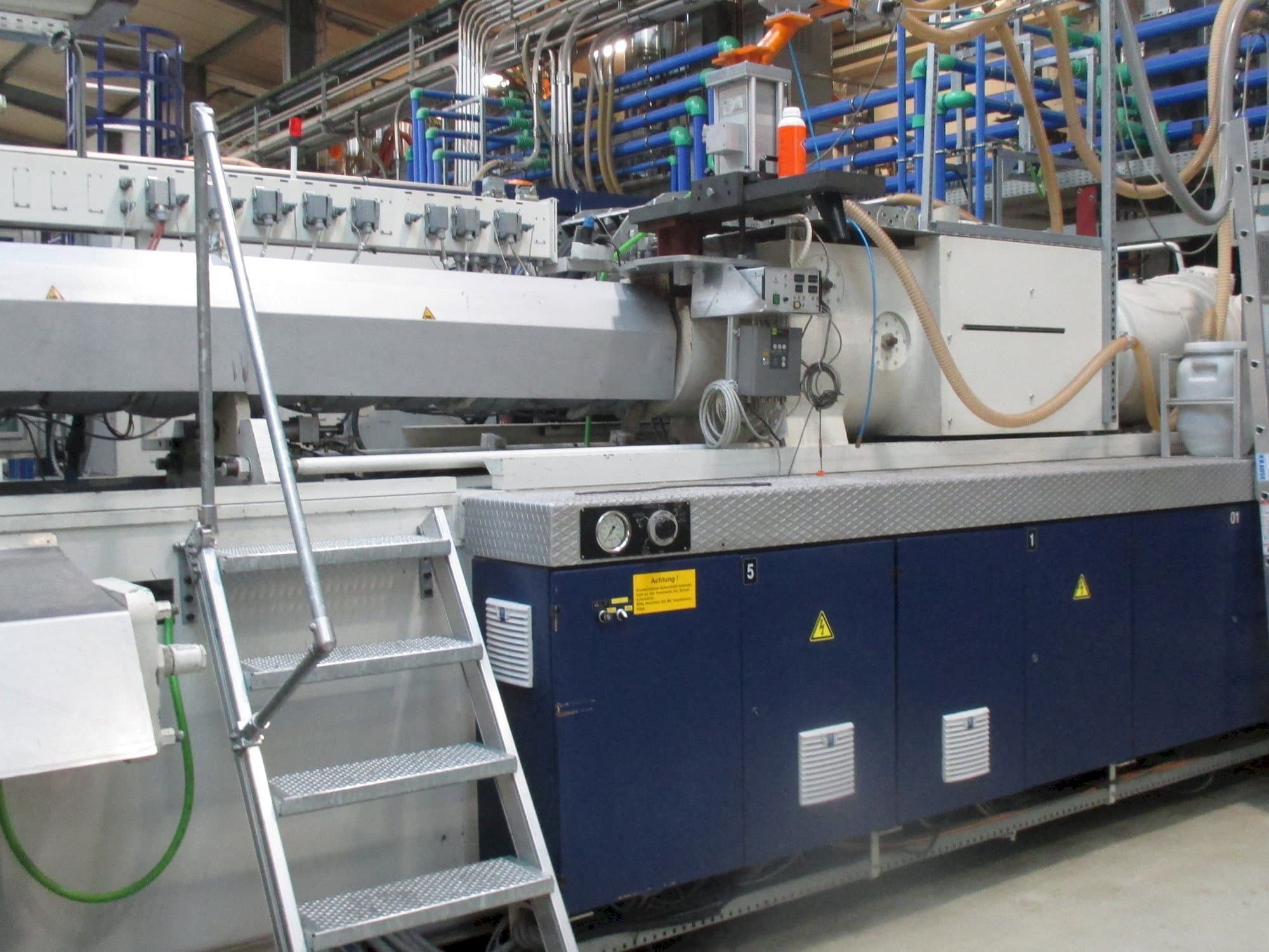 Front view of Krauss Maffei 1300/14700 MC machine