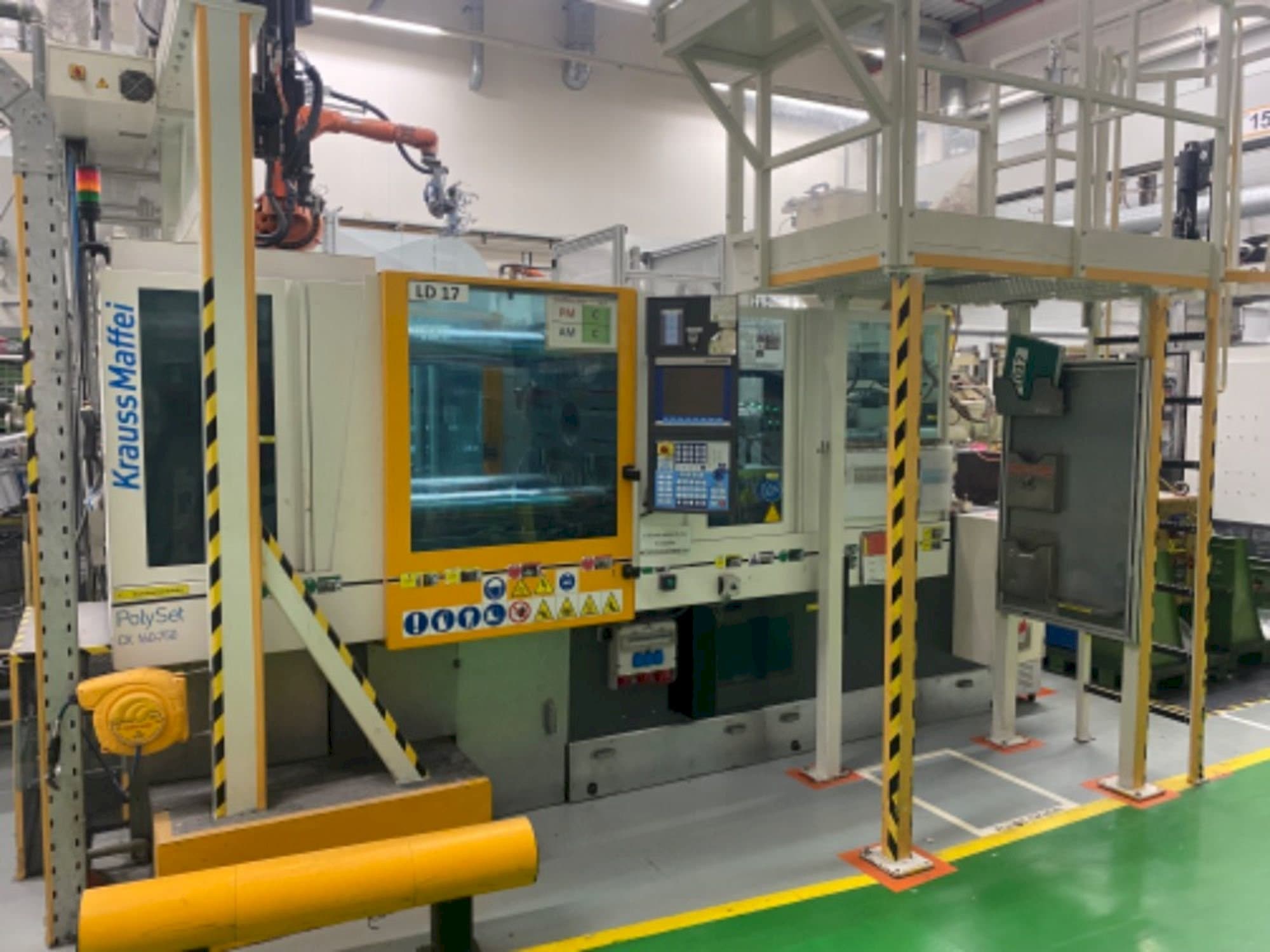 Front view of Krauss Maffei 160/750 CX POL machine