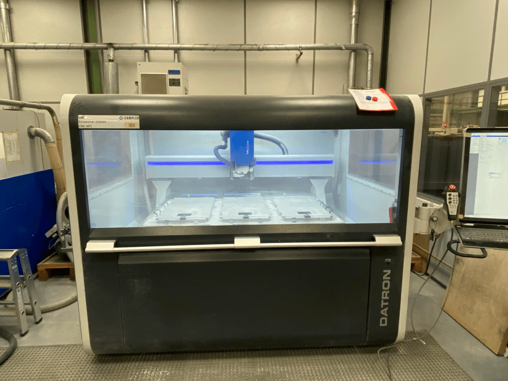 Datron MLCube B vertical machining centre, front view, showcasing the machine interior and control panel.