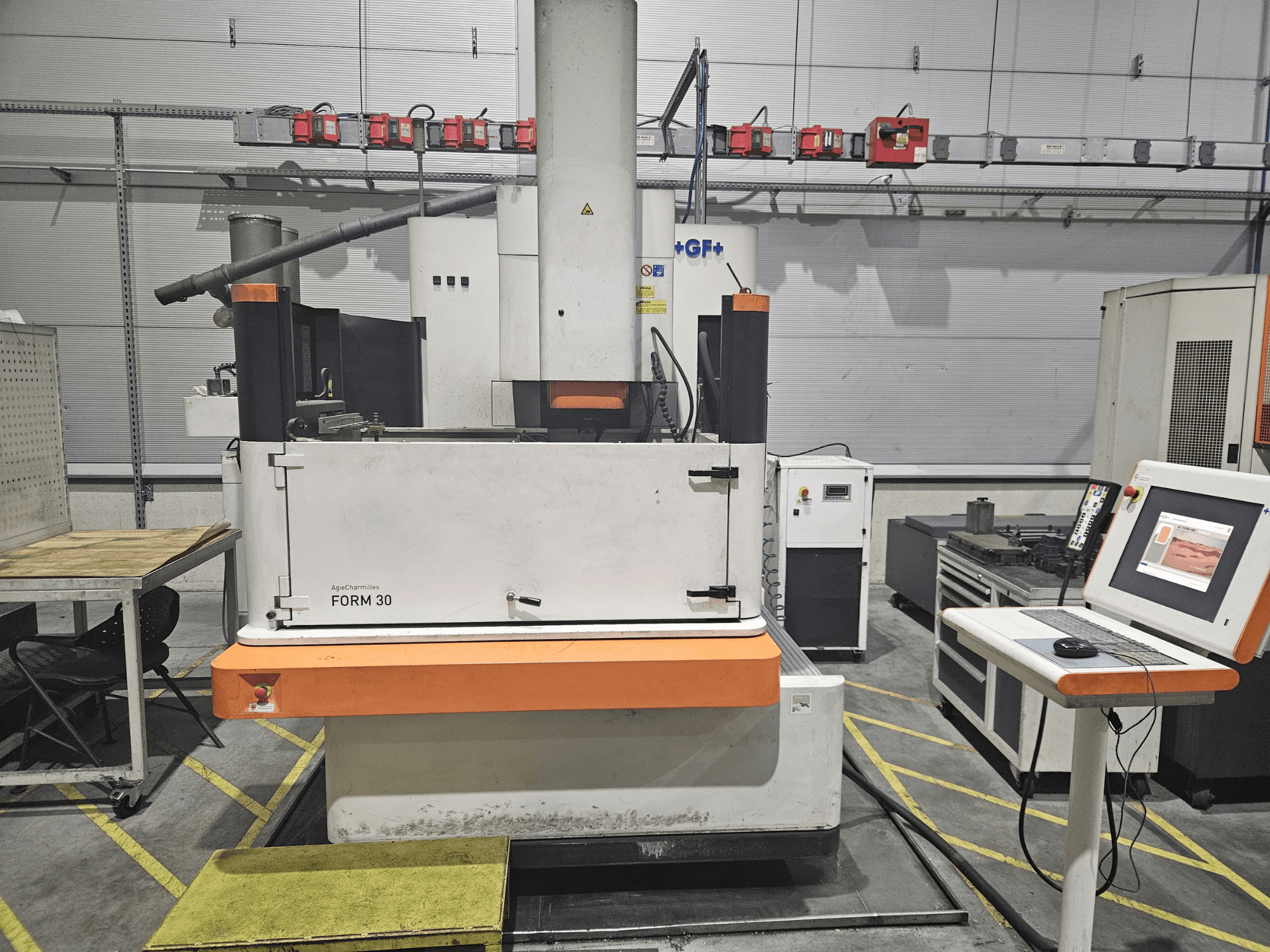 ApeqChemicals FORM 30 machine in a workshop, front view with control panel and work table to the side.