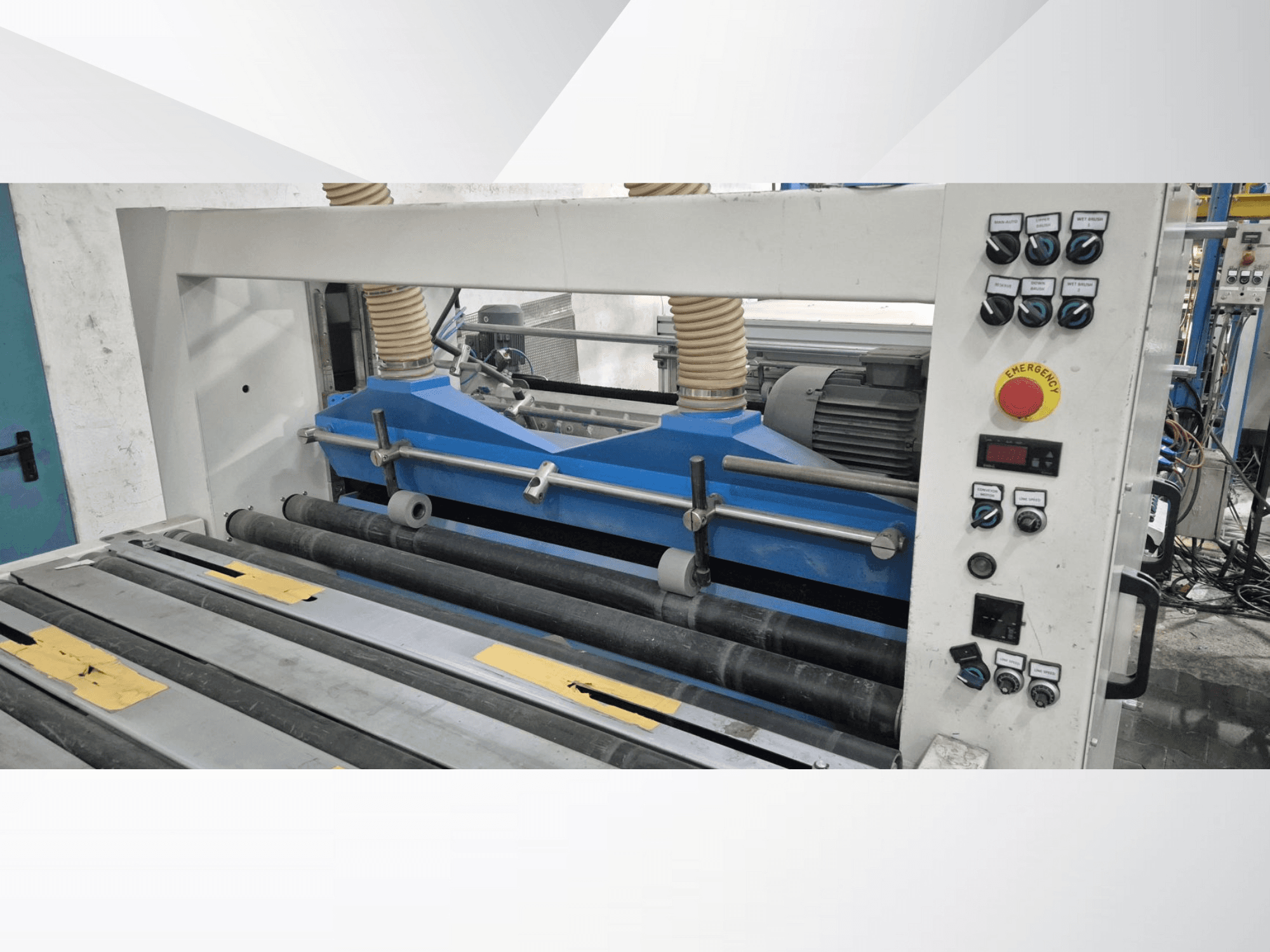 Industrial rolling machine with blue components, front view, featuring control panel and emergency stop button.