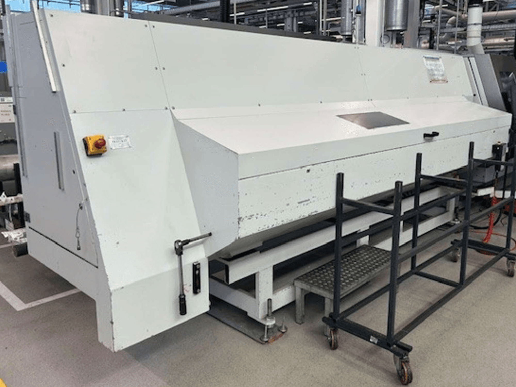 Turn-mill centre Index G 200 RATIO LINE in a side view, featuring a white body and safety controls for operation.