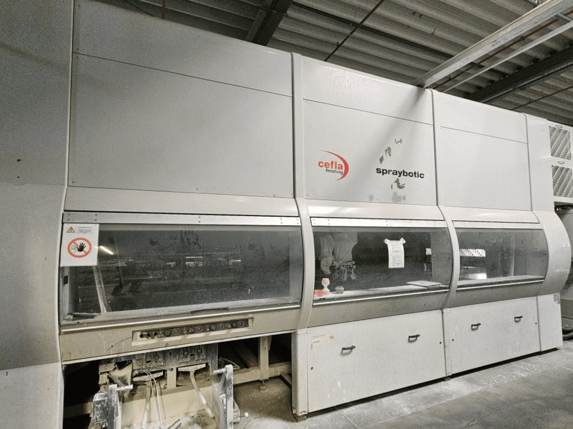 Cefla Spraybotic MD production line for wood, front view, showcasing control panel and clear display windows.