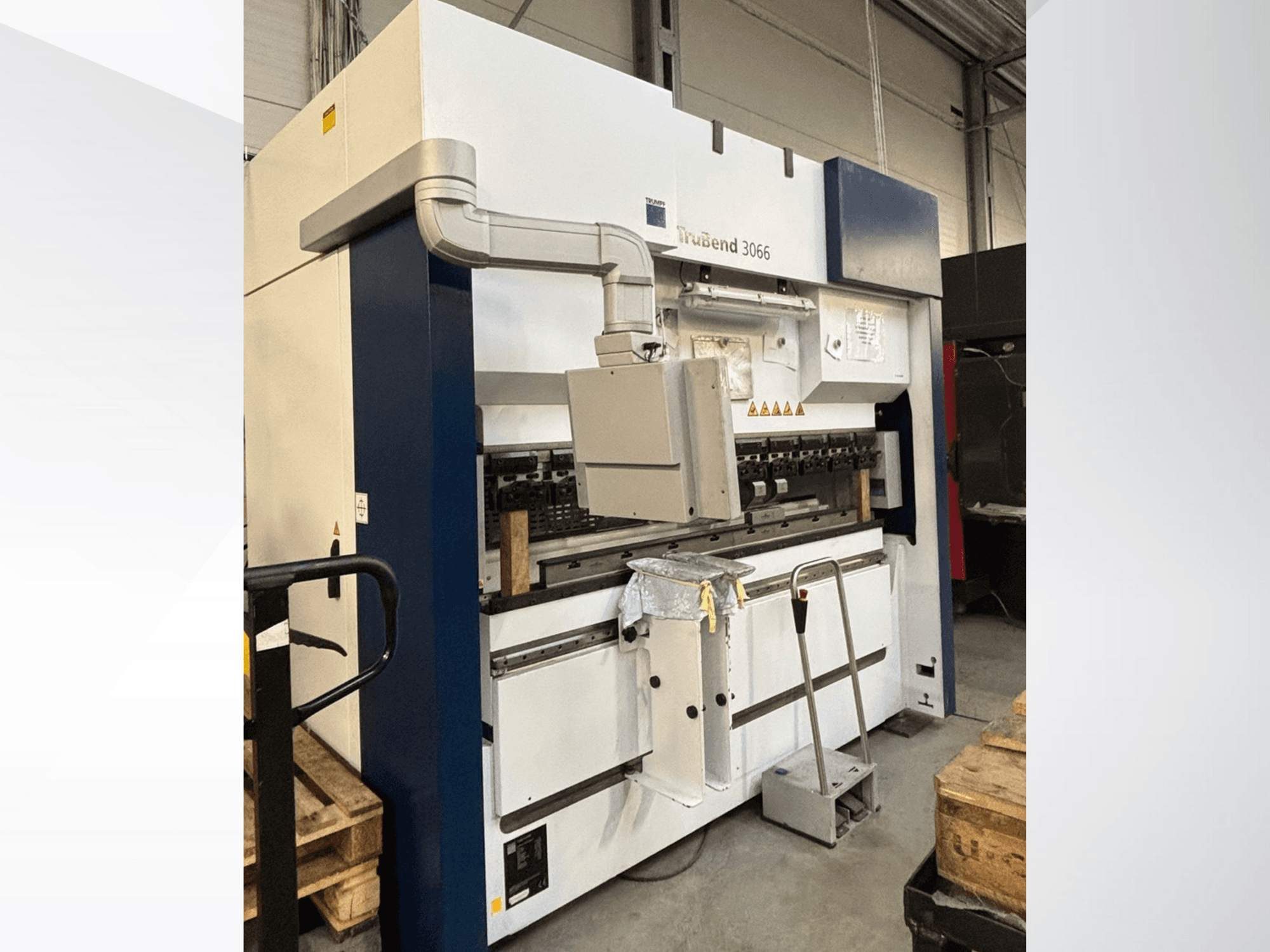 Trubend 3066 bending machine, front view, showing controls, metal frame, and safety features in a workshop setting.
