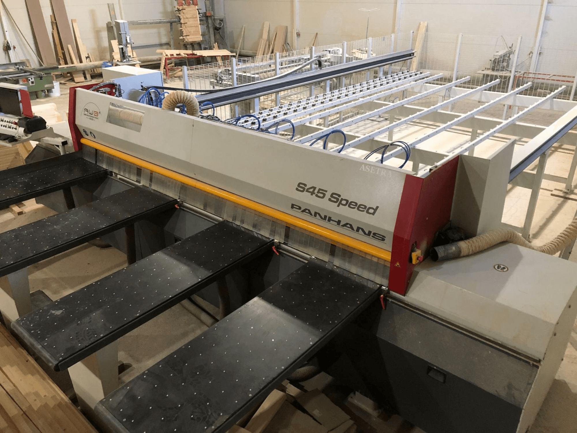 Side view of a PANHANS S45 Speed panel saw, featuring a five-table setup and visible control panel with dust extraction.