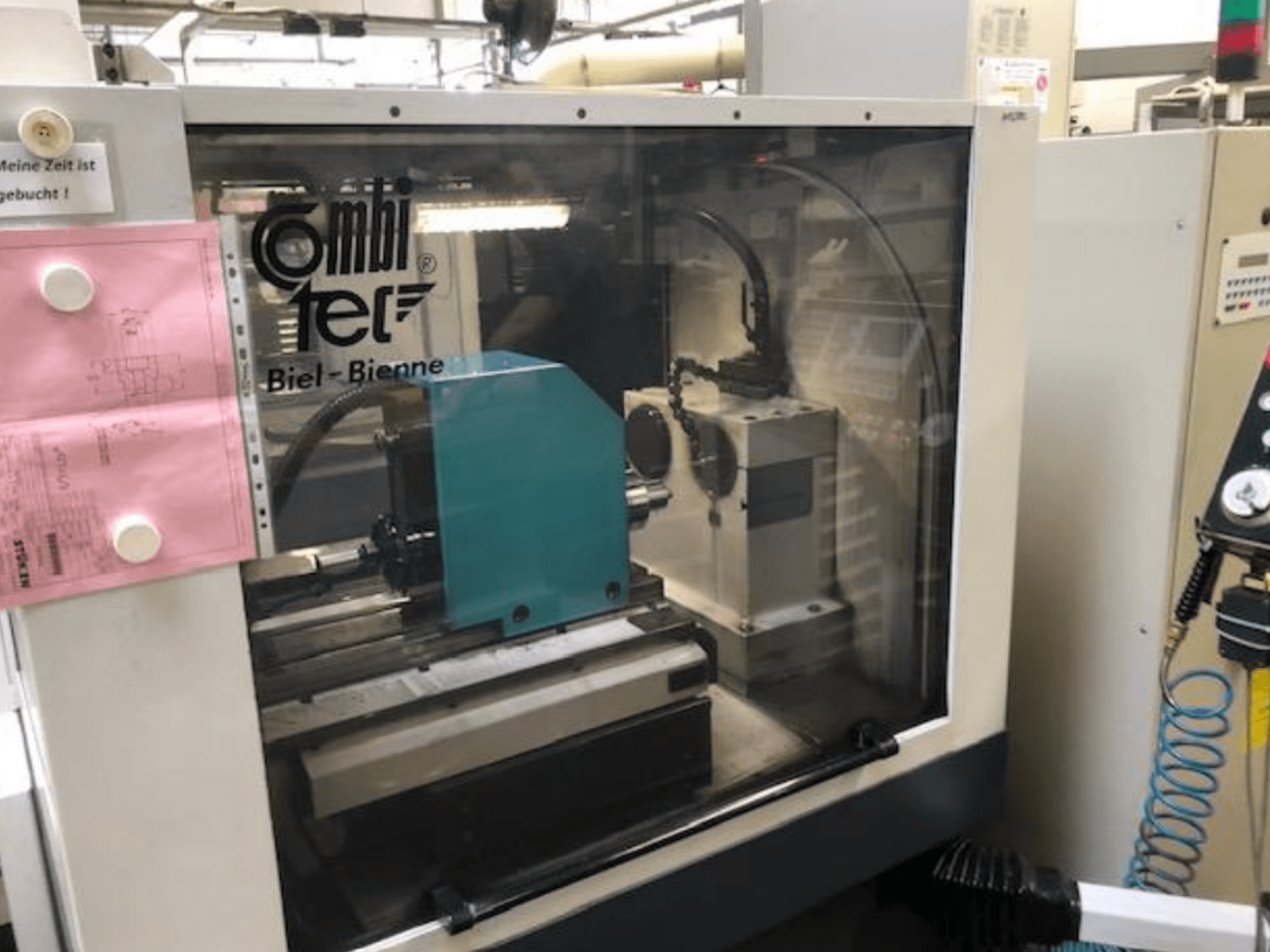 Cylindrical grinding machine Combitec CT-450 viewed from the front, featuring control panel and operational setup.
