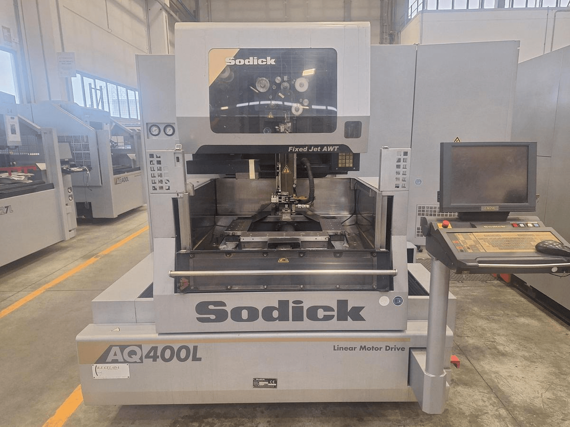 Sodick AQ400L linear motor drive machine shown from the front, featuring a control panel and internal working area.