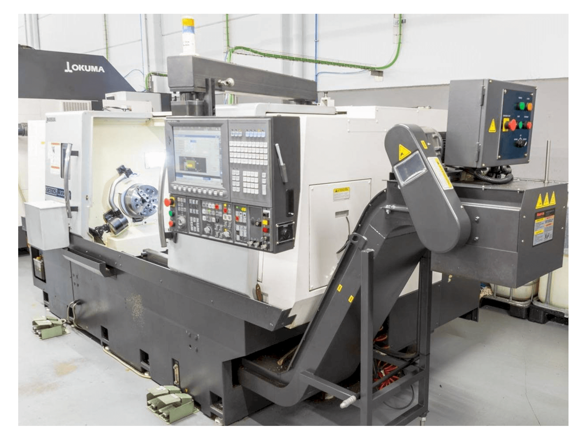 Front view of Okuma Genos L300E-M machine