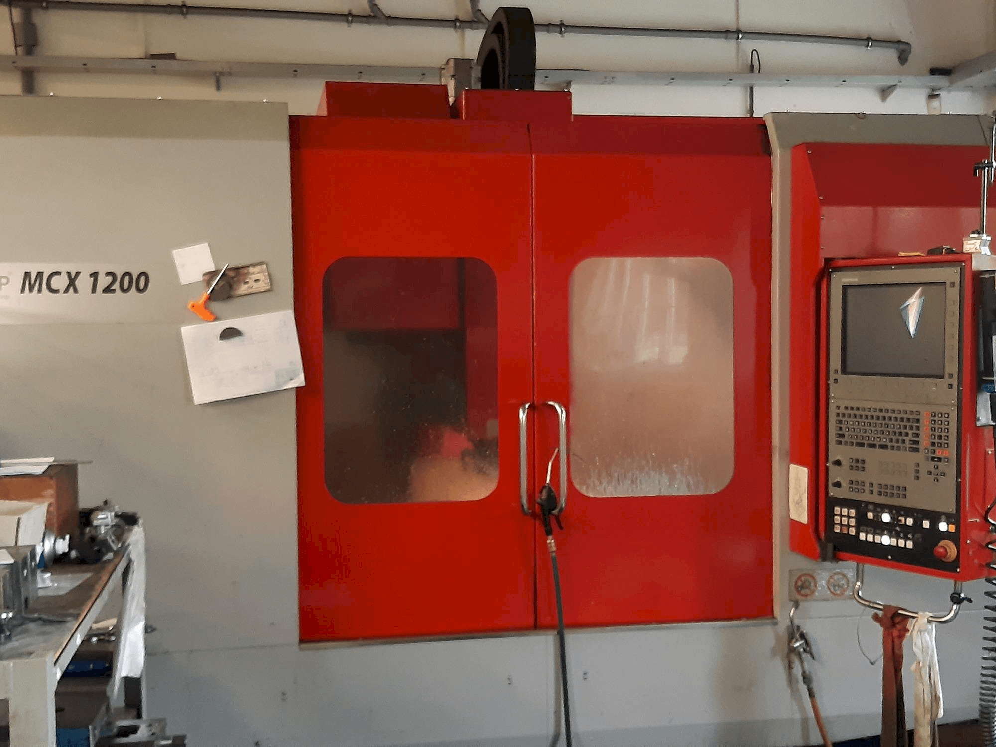 Front view of EMCO MCX 1200 machine