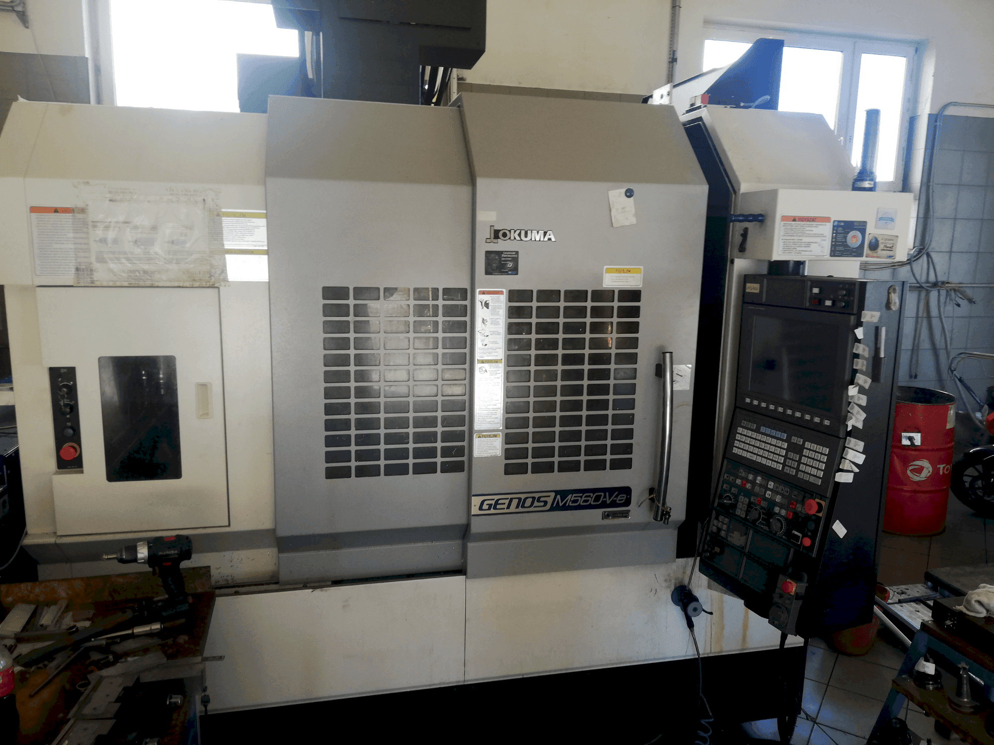 Front view of Okuma GENOS M560V-e machine