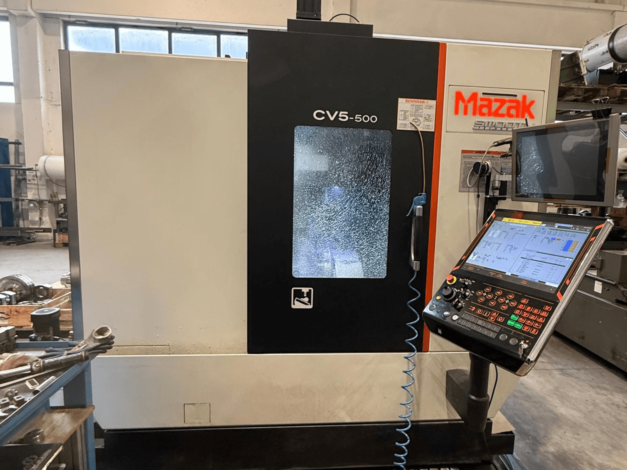 Mazak CV5-500 vertical machining center, front view with control panel and display, showcasing operational settings and interface.