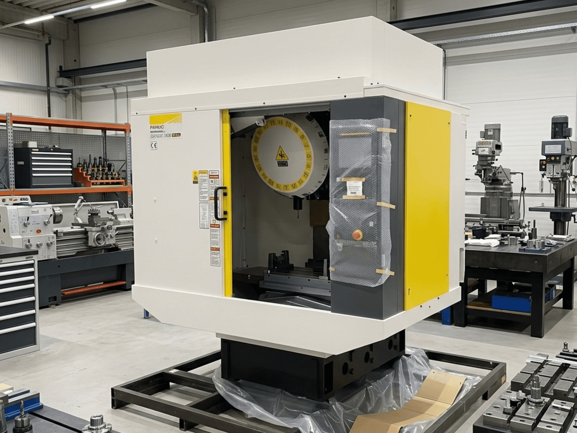 FANUC Robodrill Alpha D21LIB5 Plus vertical machining center in side view, showcasing control panel and work area.