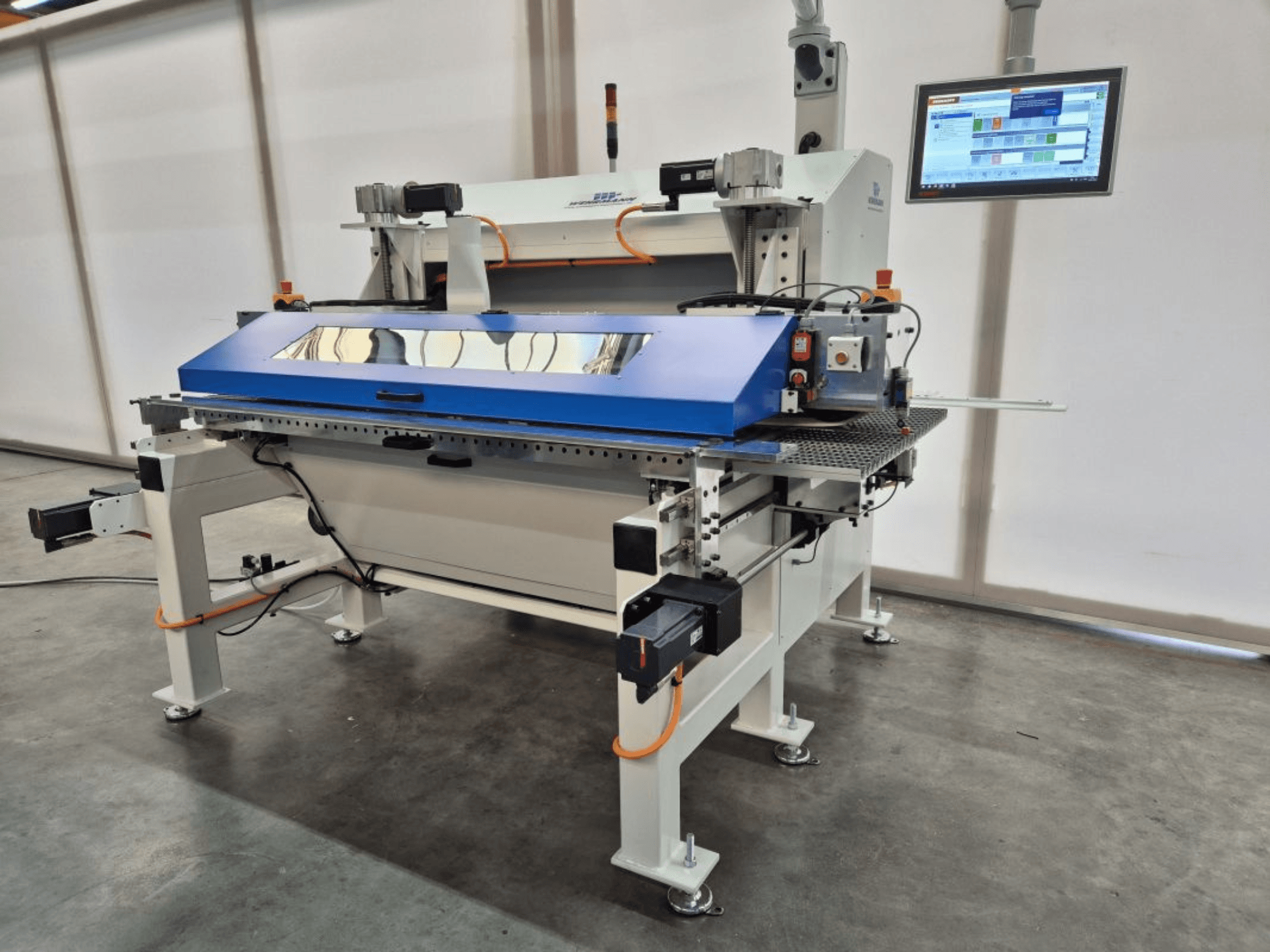 WEHRMANN WT-50/900 panel saw in front view, showcasing its blue cutting surface, digital control panel, and integrated safety features.