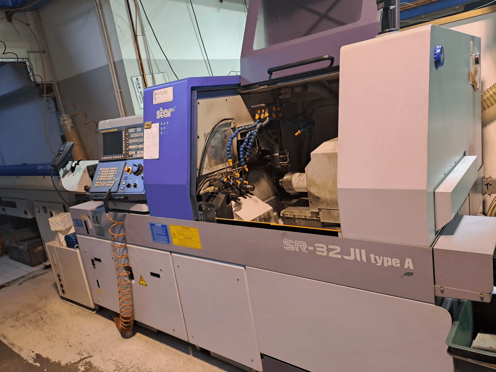 STAR MICRONICS SR-32JII-typeA Swiss Type Turning Machine side view, featuring control panel and visible machining components.