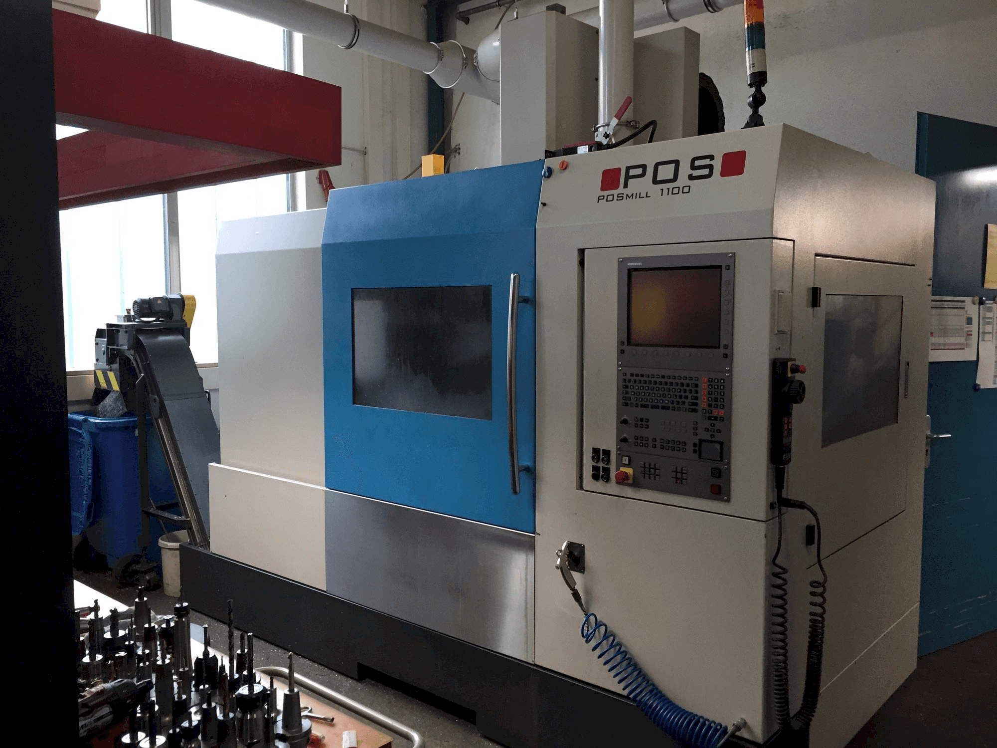 Front view of POS POSmill 1100 machine