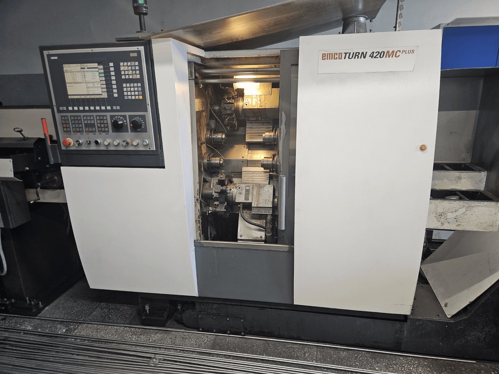 EMCO TURN 420 MC Plus multi-spindle machine, front view showing control panel and internal components.