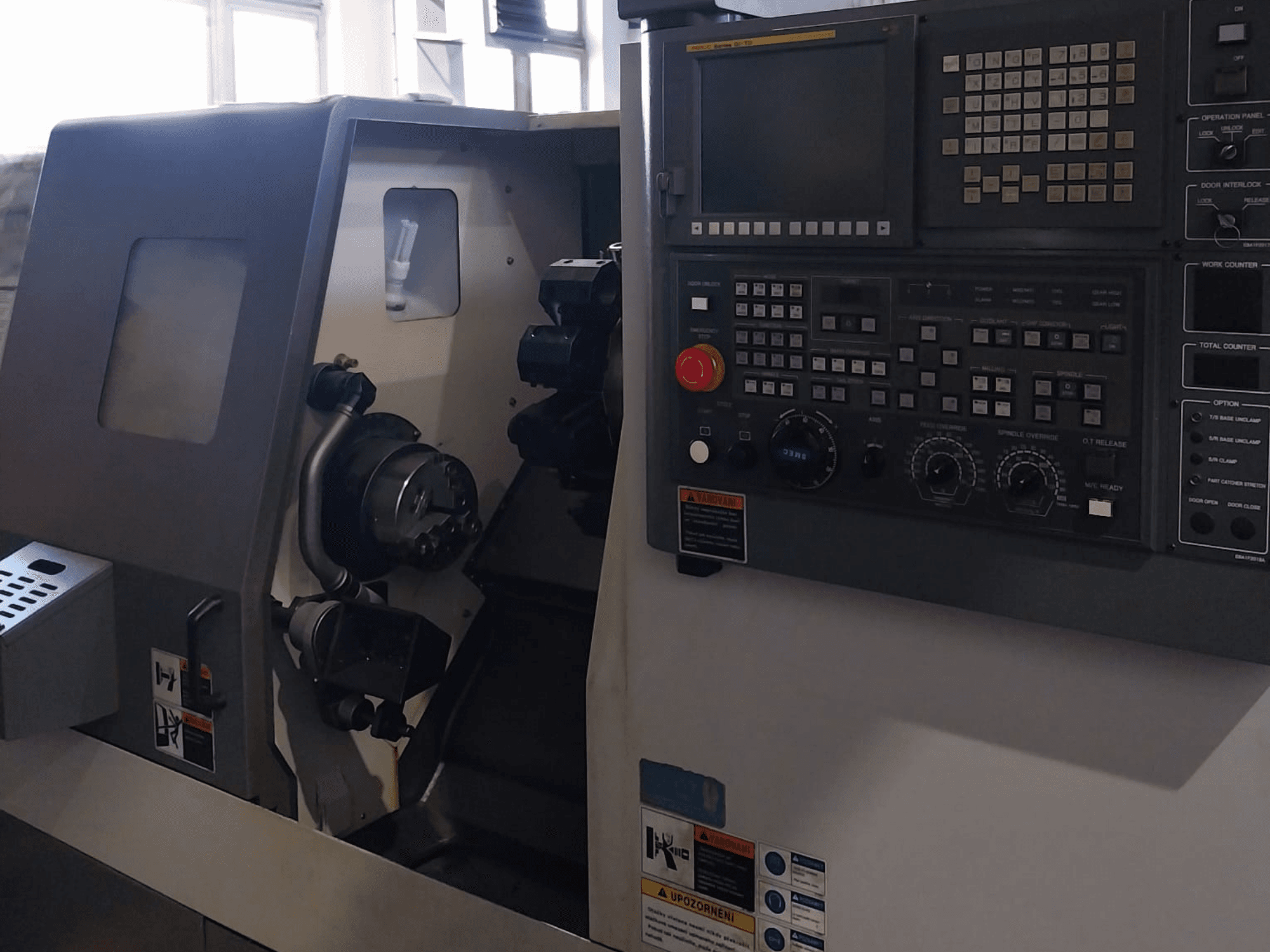 Samsung PL-20M horizontal turning machine, front view, showcasing control panel and tool head, ideal for precision machining.
