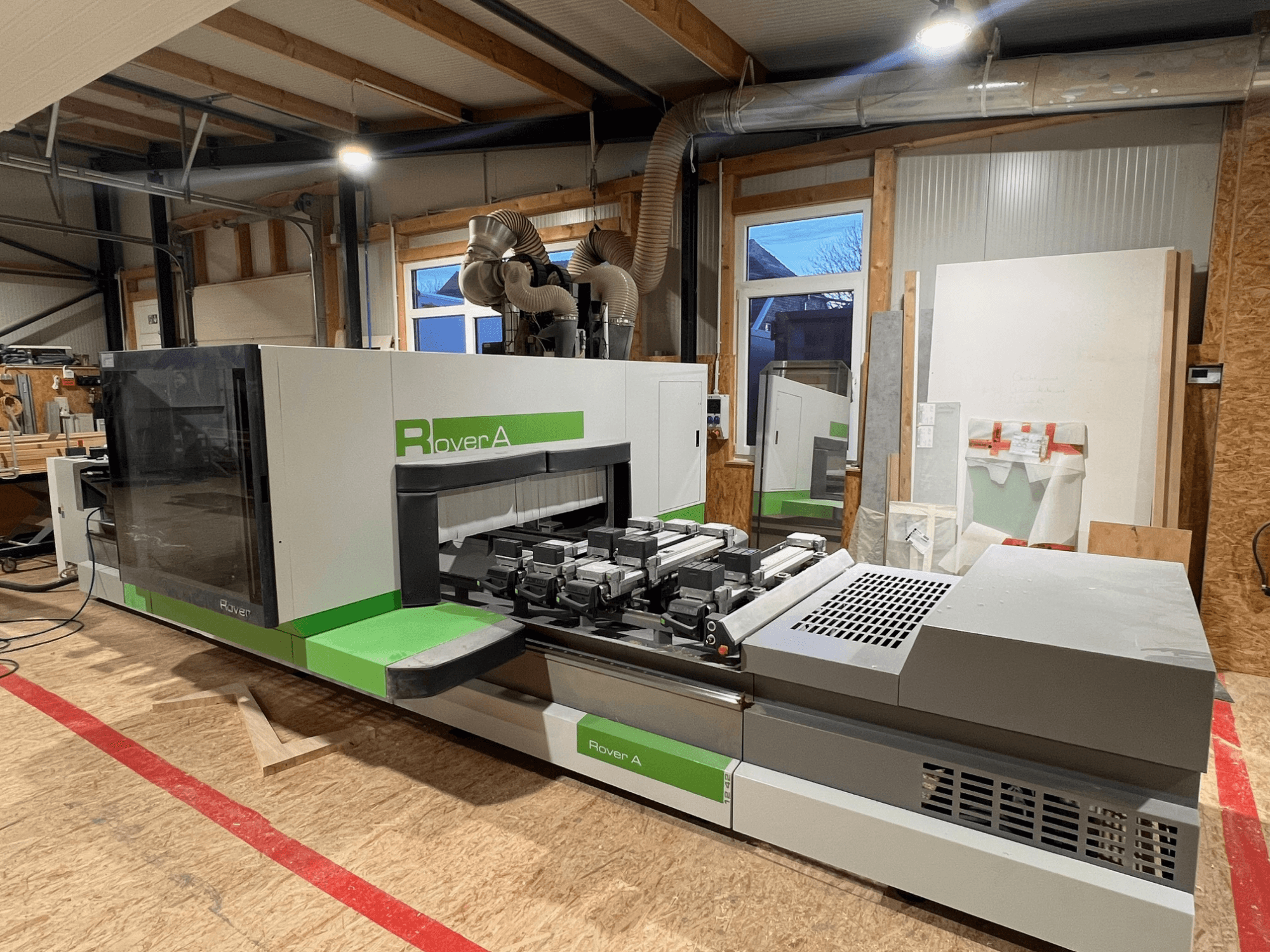 BIESSE Rover A 1242 CNC Wood Machining Centre, front view showing control panel and cutting area in a workshop setting.