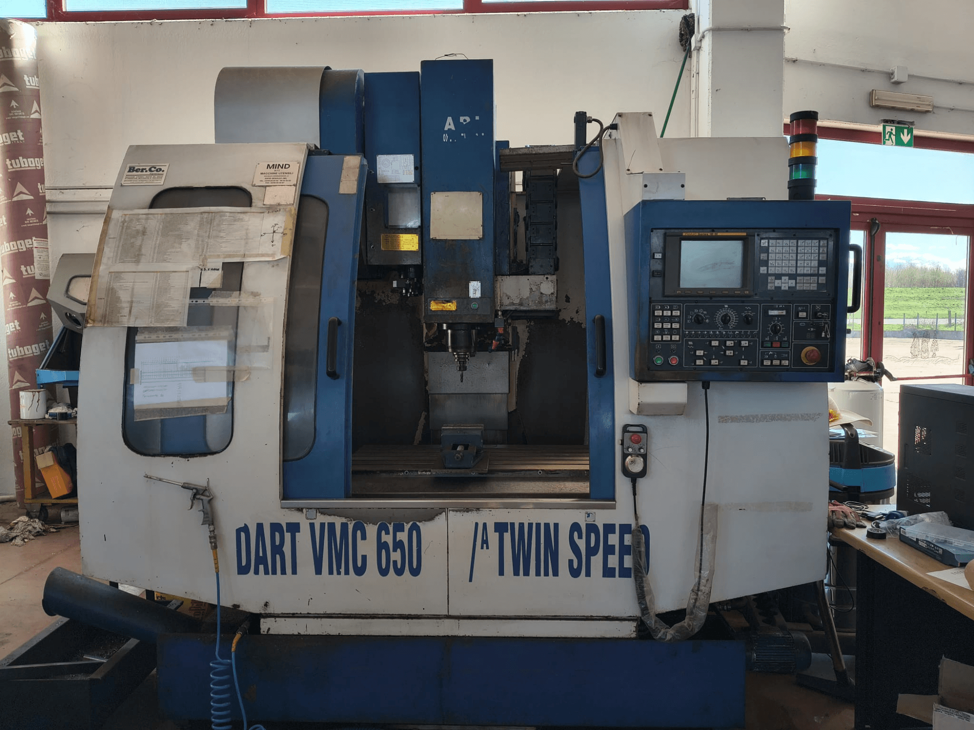 DART VMC650 XL/A T.S vertical machining center, front view, featuring control panel, tool holder, and operational details.