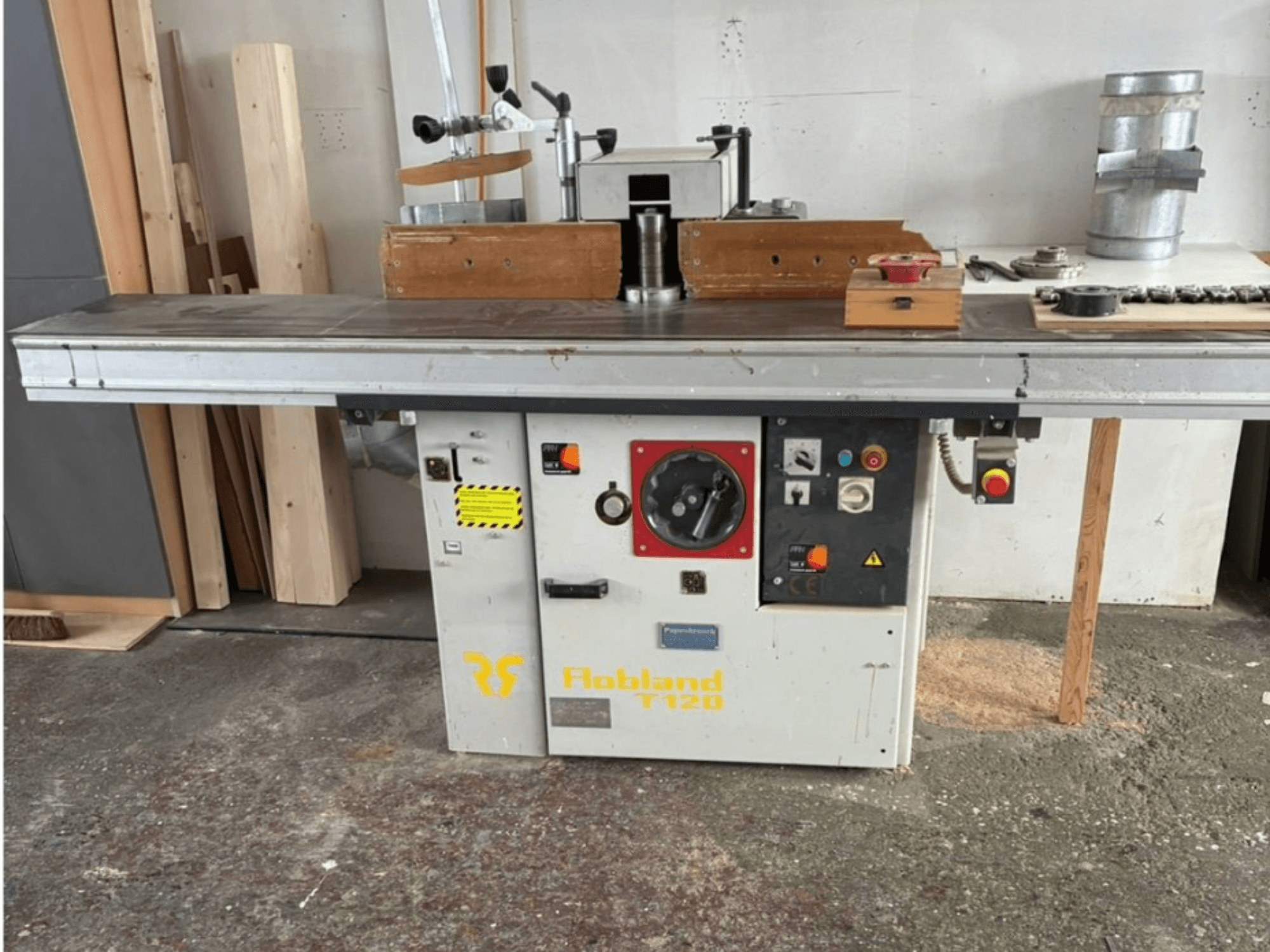 Hobbland T120 tabletop planer, front view, features a silver surface, control panel with buttons, and safety labels.